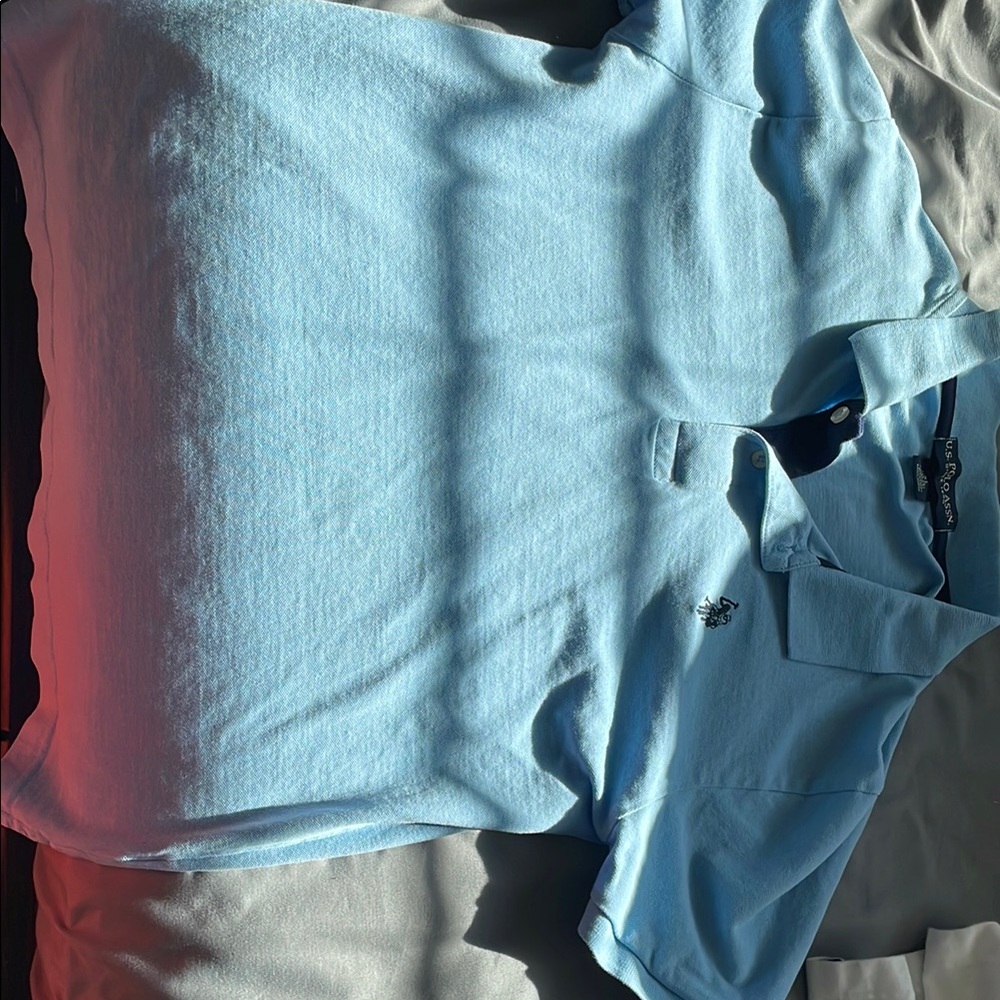 U.S. Polo Assn. Light Blue Polo Shirt (14-16) in boys sizes.